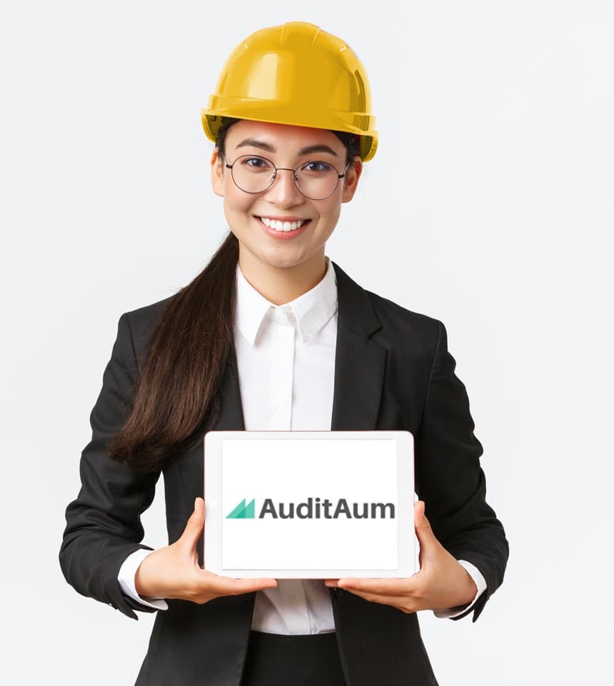 Auditor holding a tablet showing AuditAum